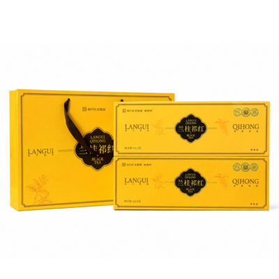 Luxury golden gift box with matching handbag for orchid osmanthus flavored Keemun black tea, premium packaged for gift giving and daily brewing
